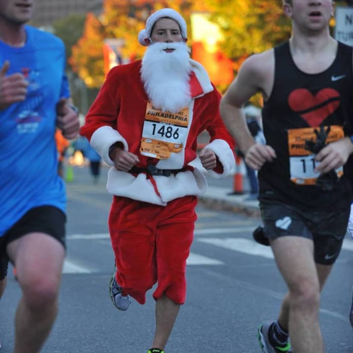 Brian Lang, formerly of Dumont, runs a marathon in full Santa gear.