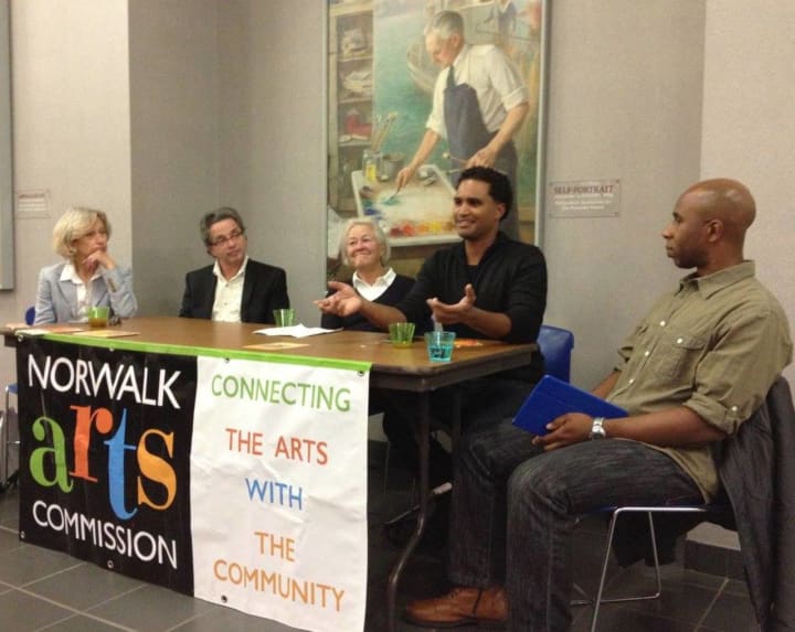 During a panel discussion at the &#x27;Made In Norwalk&#x27; exhibit, Vladimir Mariano points out how people in all sorts of jobs can invent amazing things. Also on the panel are Laura Einstein, Jeffrey Price, moderator Susan Wallerstein, and Gerald Myles.