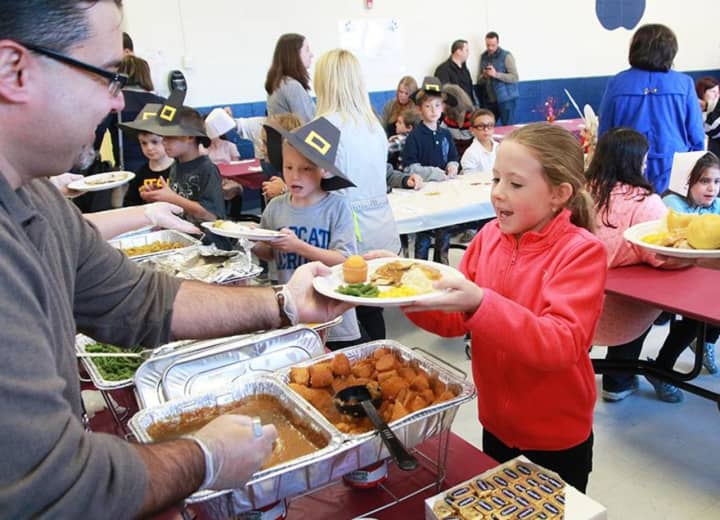 Columbus Elementary third-graders and their family shared an early Thanksgiving meal at the annual Thanksgiving Feast.