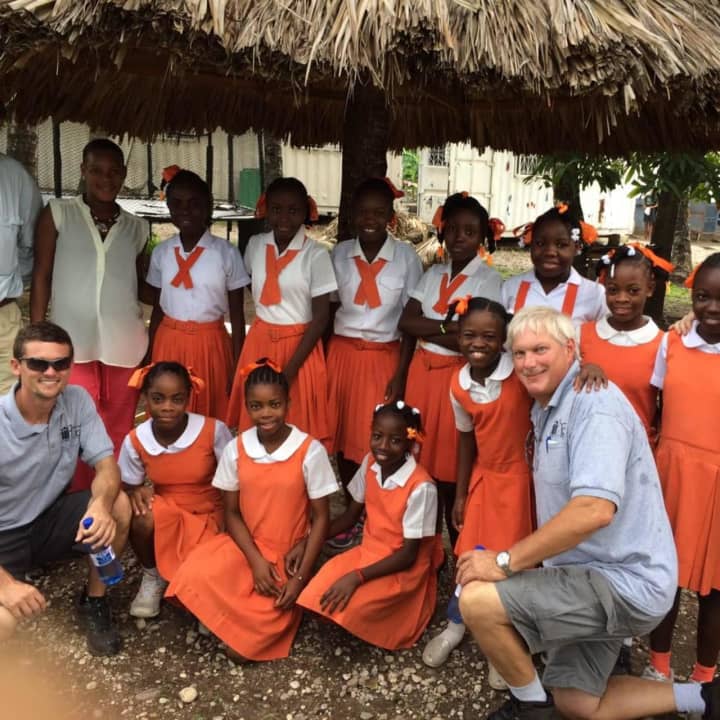 North Haledon pilot and minister Andrew Topp, far right, is remembered for his humanitarian work in Haiti.