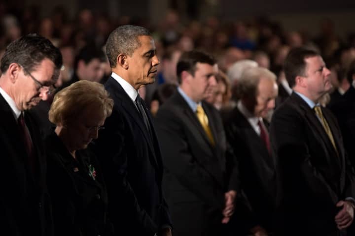 President Barack Obama visits families and takes part in a memorial service in Dec. 16, 2012, two days after the deadly mass shooting at Sandy Hook Elementary School.