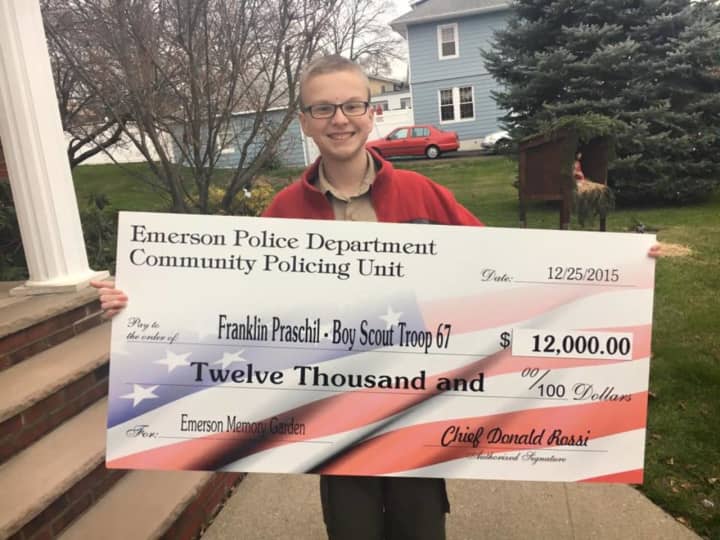 The EPD presented a $12,000 check to Emerson Boy Scout Franklin Praschil, 15, who is bringing working on constructing a memory garden.