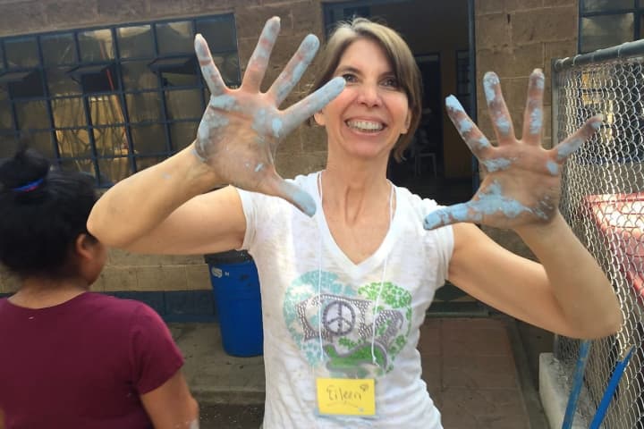 Eileen Geraghty of Upper Saddle River helping to paint a shelter for Guatemalan girls who were formerly slaves.