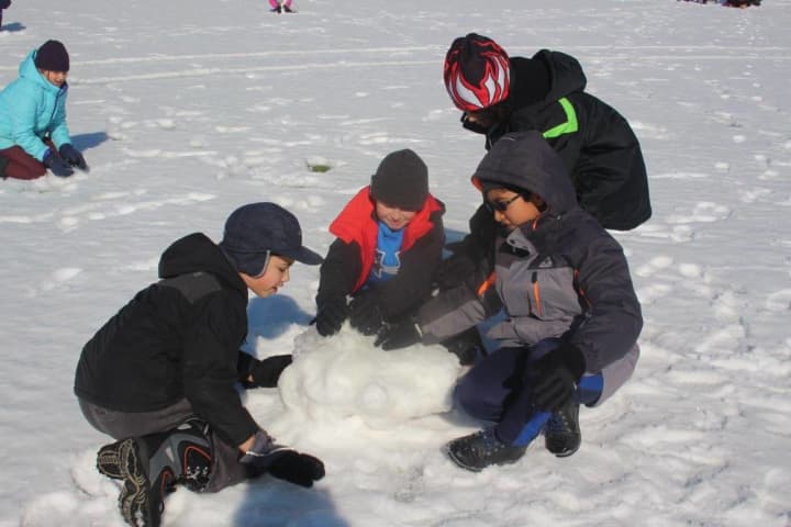 Pleasantville children play in the snow.