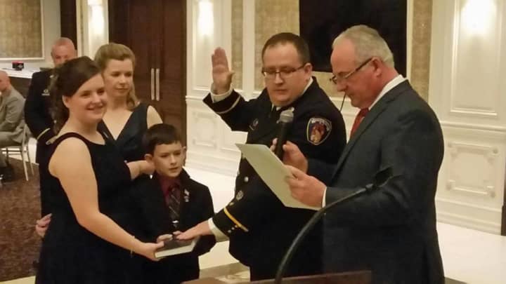 Tom Dickman is sworn in as Saddle Brook fire chief on Sunday.