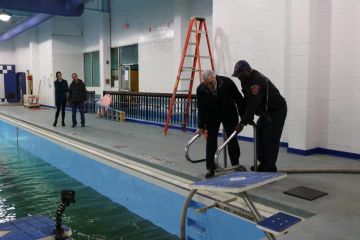 Members of the New Rochelle Chamber of Commerce helping get the pool at the YMCA ready.