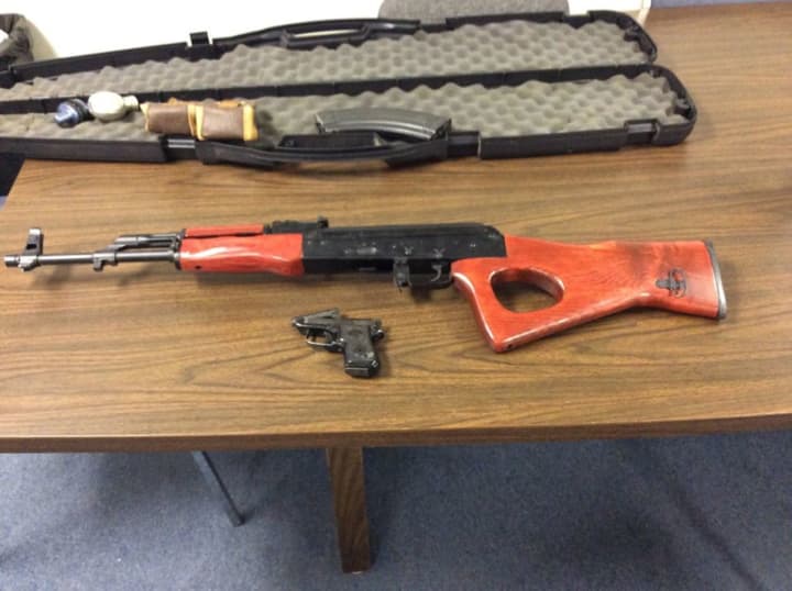 A Suffern man is facing weapons charges after officials found an AK-47 in his apartment.