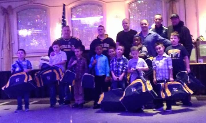 Saddle Brook kids and coaches celebrate at the year-end football dinner.
