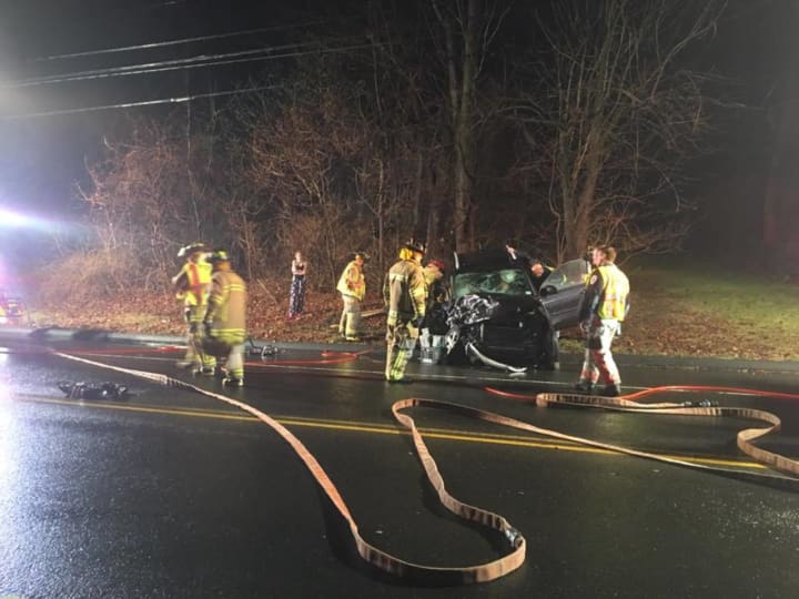 A two-car crash in Trumbull Wednesday sent two people to the hospital, firefighters said.