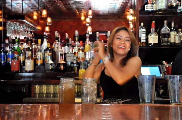 Cuban Habana Cafe bartender Natalie Moscoso mixes up drinks for Sunday brunch.