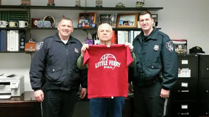 Officer Michael Hinchcliffe, Chief Ralph Verdi, and Officer Michael Derwin with new Little Ferry P.A.L. Basketball shirts.