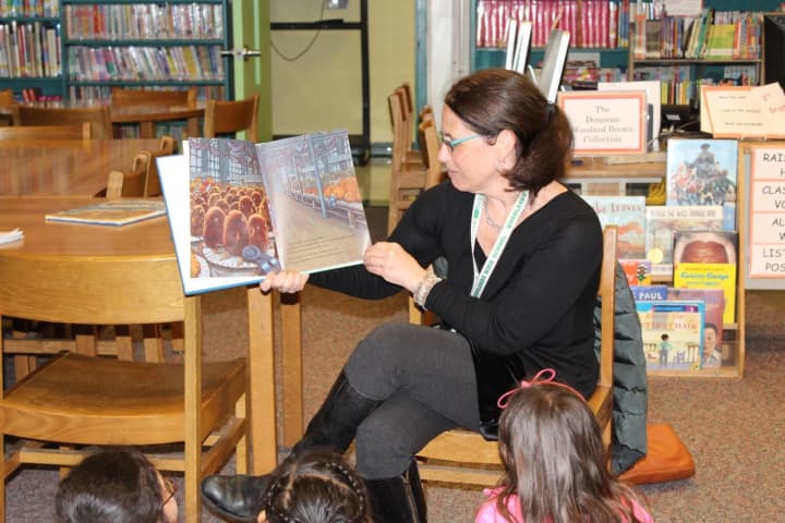 Woodlands High School Librarian Joy Alter reads at Highview on World Read-Loud Day celebrated in Greenburgh elementary schools.