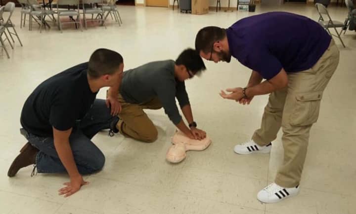 Garfield EPIC members practicing CPR.