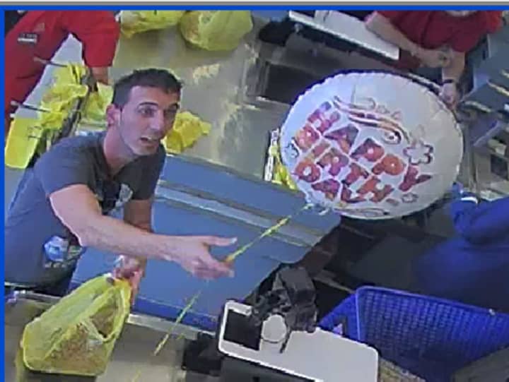 Stamford police are trying to identify the man pictured, who is accused by police of using a cloned credit card.