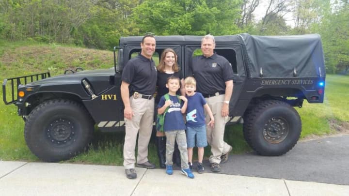 Pictured are Detective Powers, Keri Pesavento of Children&#x27;s Connection, Chief Troxell, Jameson and Tyler.