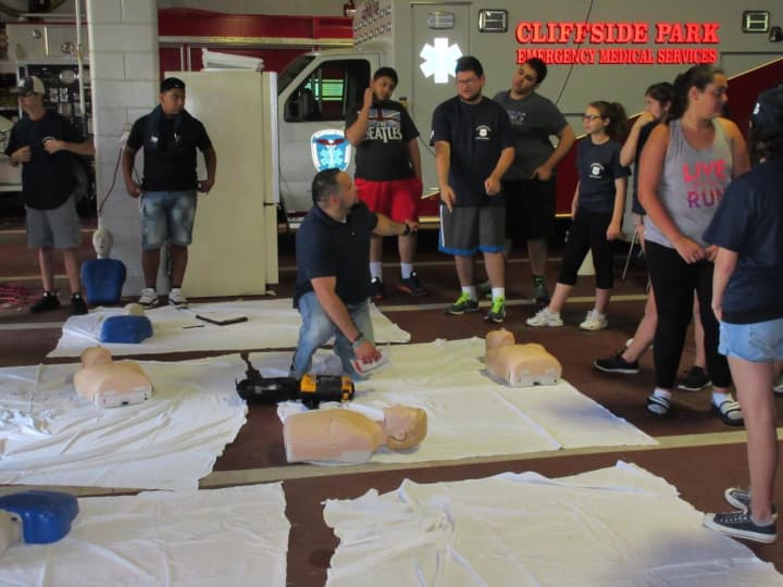 Christian Ventura leads CPR and first aid training class.