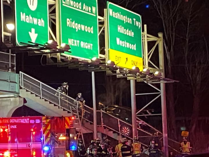 The SUV crashed onto the steps of the pedestrian bridge on Route 17 near Linwood Avenue.