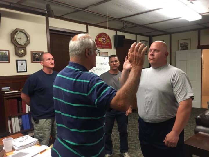 Craig Thompson being sworn in as Nichols Fire Department&#x27;s newest captain.