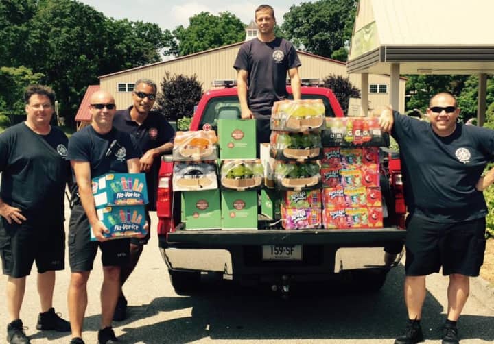 Stratford firefighters drop off donations for campers and for the food pantry at Sterling House which is currently in need of food.
