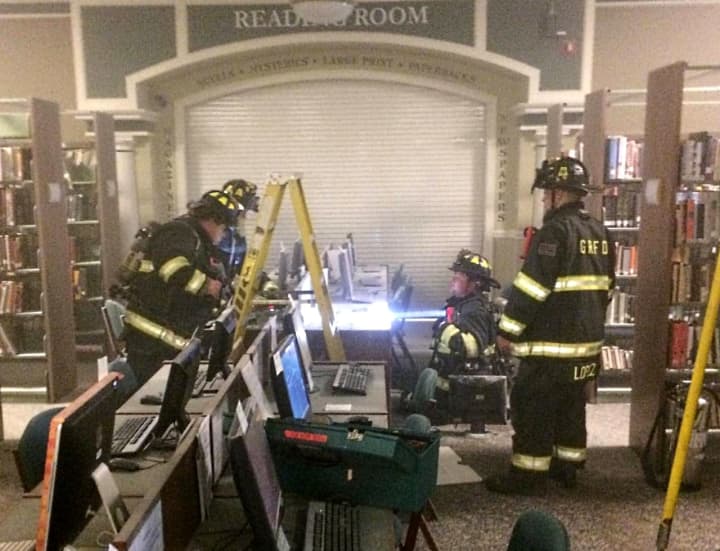 Firefighers and library staff used hand-held extinguishers to snuff the flames.