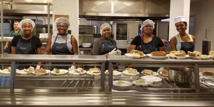 The Teaneck InterAct Club serves up meals for residents of the Bergen County Housing, Health and Human Services Center in Hackensack.