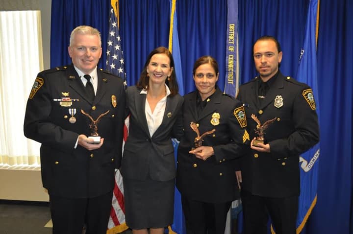 Lt. Terry Blake, U.S. Attorney Deirdre Daly, Sgt. Sofia Gulino and Officer Felipe Taborda during a Friday Community Policing Awards ceremony.