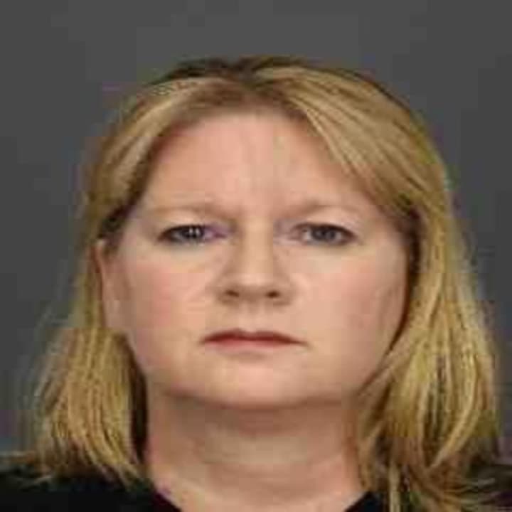Cheryl Higgins was charged with stealing $500,000 from a White Plains dentist.