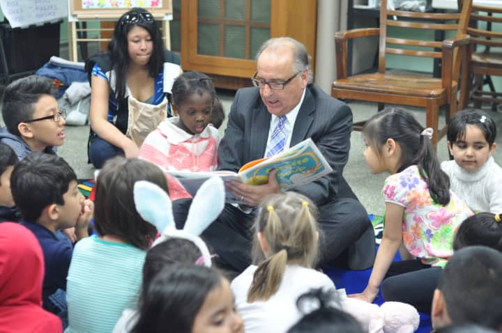 Mayor James Cassella reads to children at East Rutherford Library.