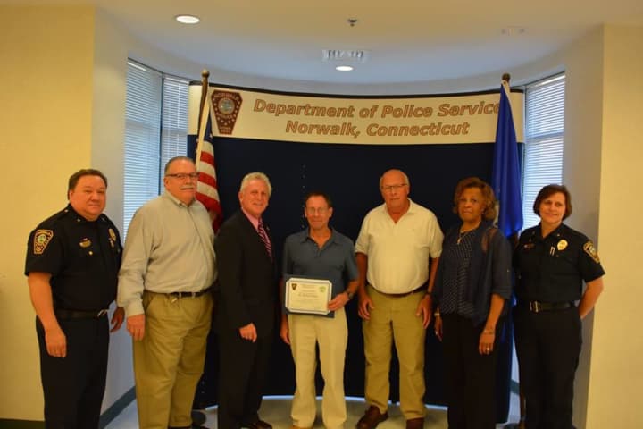 From left, Deputy Chief Ashley Gonzalez, Commissioner Charles Yost, Mayor Harry Rilling, Michael Golden, Edward Brennan, Commissioner Fran Collier-Clemmons and Deputy Chief Susan Zecca.