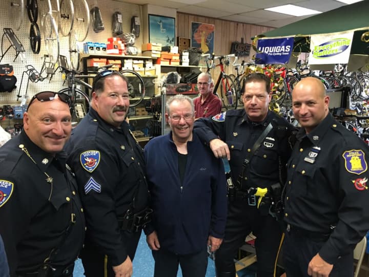 Danny Dentaroli, center, recently celebrated his 50th year in business in Yonkers. The Police Department threw a special party to celebrate.