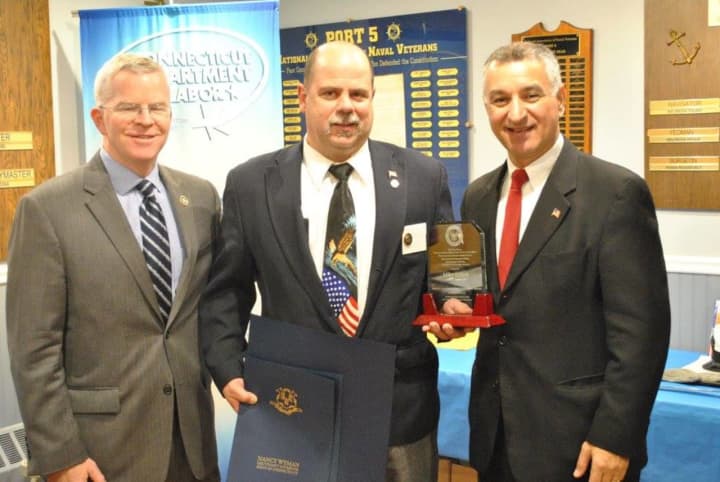The 2016 awardee, Mike Kellett, center, is flanked by Sean Connolly, commissioner of the CT Department of Veterans&#x27; Affairs and state Sen. Carlo Leone.