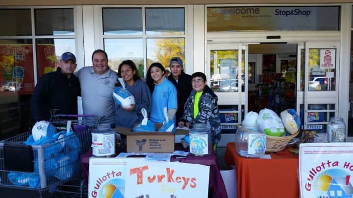 Gullotta House and other local organizations are collecting Thanksgiving turkeys for families in need. Matthew Gullotta, second from left, was joined by volunteers from Sleepy Hollow and Ossining high schools recently at the Stop &amp; Shop on Route 9.