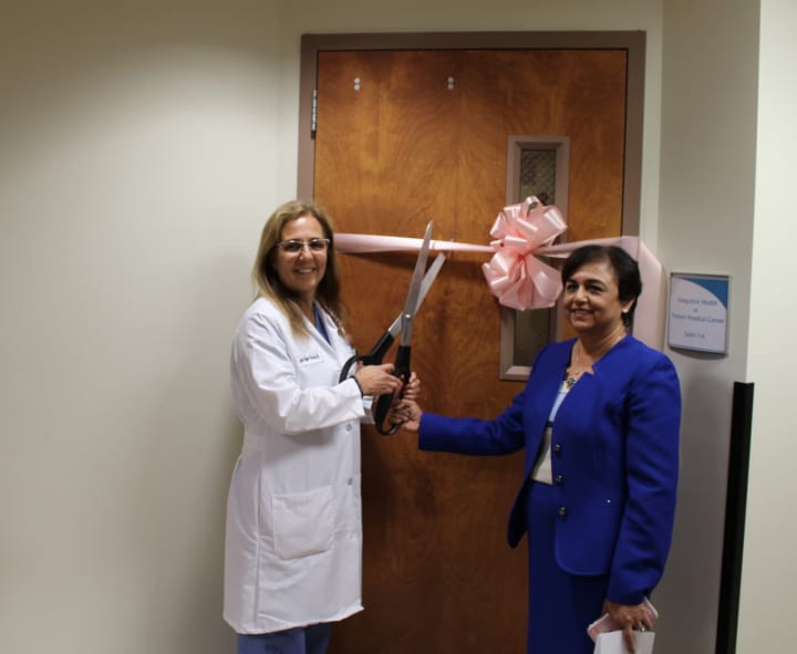 Dr. Lyda Rojas, left, and Dr. Vinita Agarwal cut the ribbon on the new Integrative Health program at Putnam Hospital Center.