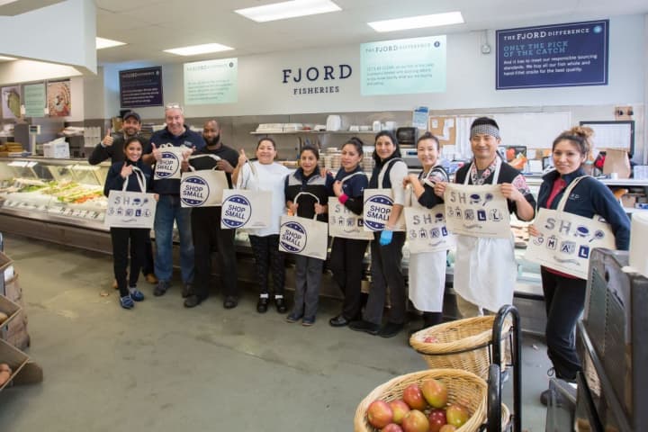 The team at Fjord Fish Market took a quick break from preparing for their lunch crowd to show their enthusiasm for supporting our local community and for Small Business Saturday&#x27;s event.