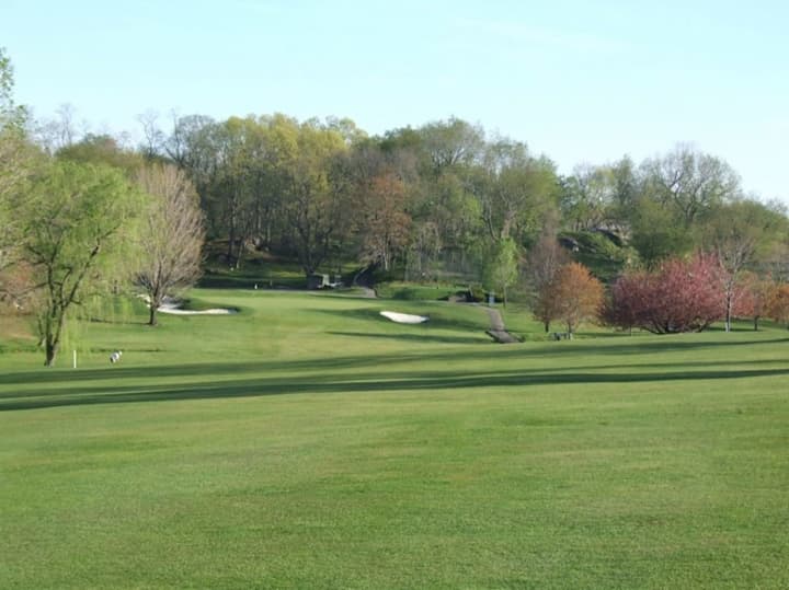 A 49-year-old Stamford man accused of burglary was arrested Thursday after hopping a fence into the E. Gaynor Brennan Golf Course while trying to evade capture.