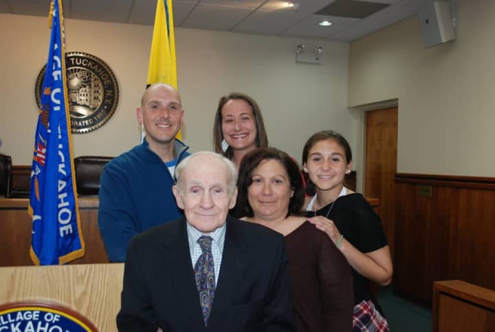 Dr. John F. Salimbene, who served as the Tuckahoe Police Department’s surgeon for five decades, was killed in a house fire last weekend.  He is shown with family members at an award ceremony in May where he was presented with a plaque.