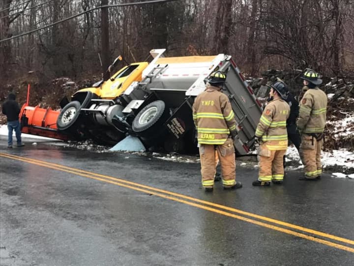 Moseman Road is closed after a salt truck ended up on its side Tuesday.