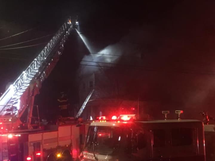 As many as 50 firefighters from multiple agencies responded to Elm Street in New Rochelle to battle a three-alarm blaze.