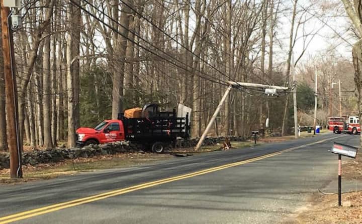 The Fairfield Fire Department responds to a truck crash that took down wires Monday on Burr Street.