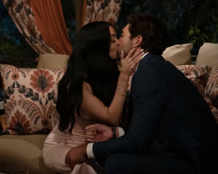 Allie Hollinger, the younger Hollinger sister, steals a kiss from Joey Graziadei on "The Bachelor."