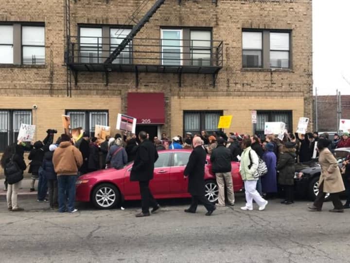 Protestors rally outside of a Jersey City apartment building owned by Clifton-based River Edge/Trendy Management.