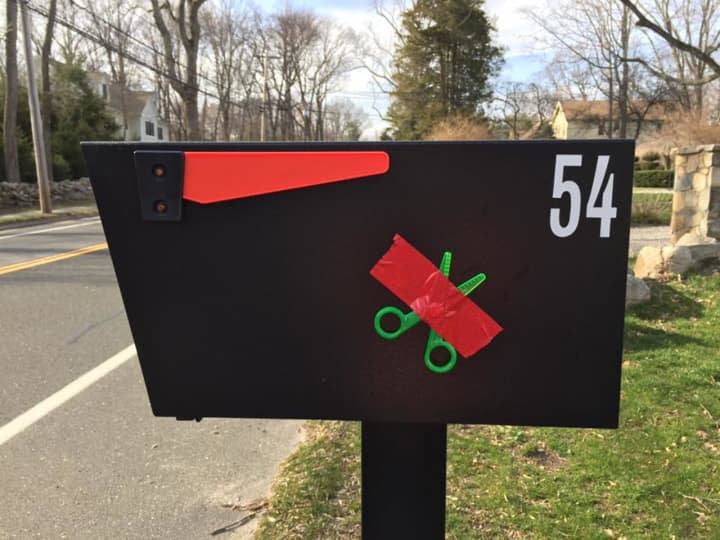 Westport residents have been attaching scissors to their mailboxes with red tape to send a message – don&#x27;t cut our school budget.