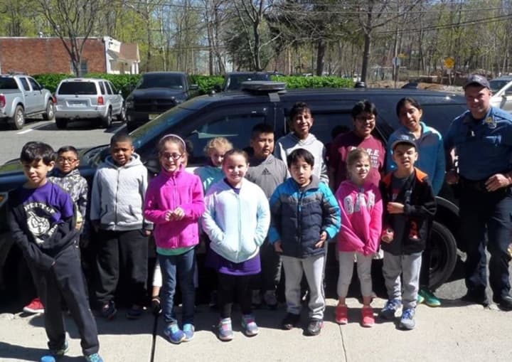 Park Ridge Police Officer Michael Lange with East Brook students after a tour of headquarters.