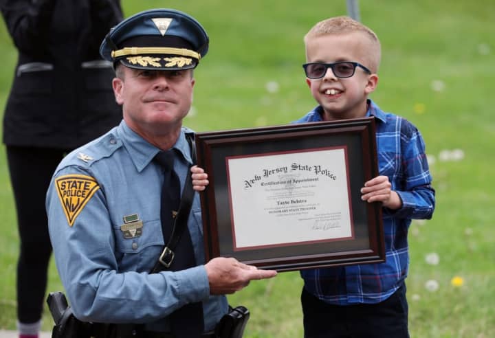 A Warren County 10-year-old battling a rare brain disorder was appointed as an honorary New Jersey state trooper.