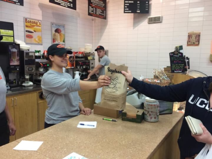 The Bagelman &quot;hand-off&quot; to a hungry customer.