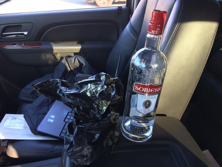 A man was arrested for drinking and driving with an open bottle of vodka.