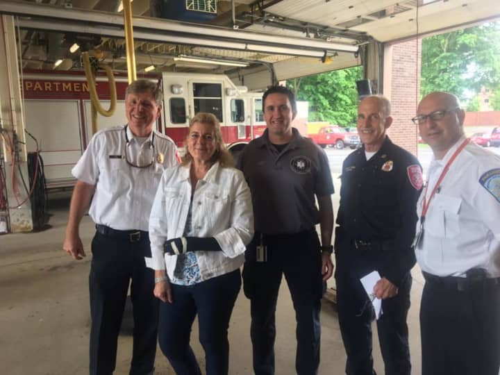 Devon Walsh with some of the responders who helped pull her from her vehicle.