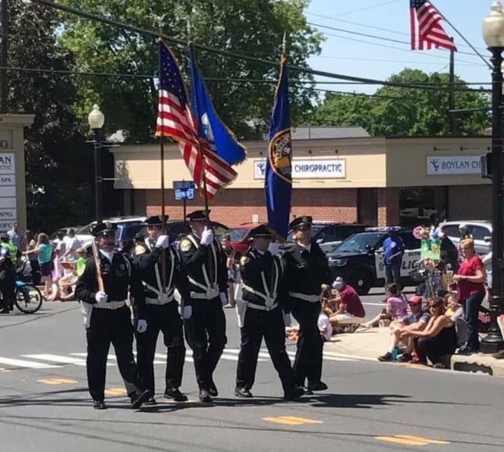The police honor guard steps off at the front of Bethel&#x27;s annual Memorial Day Parade held Sunday.