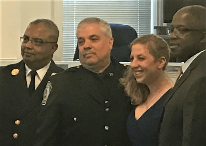 Ashley Hahn, with (from left) Fire Cheif Anthony Verley, her father, Police Officer Edward Hahn, Township Manager William Broughton.
