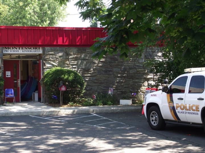 Ridgewood police respond to reports of a shell casing discovered on the playground of the Montessori School Monday.